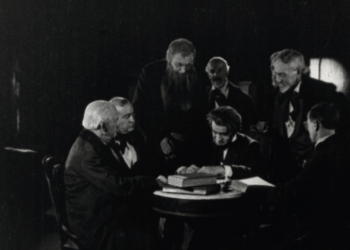 Abraham Lincoln, played by Francis Ford, signs the proclamation calling for volunteers for the Civil War in 1861 in the film.